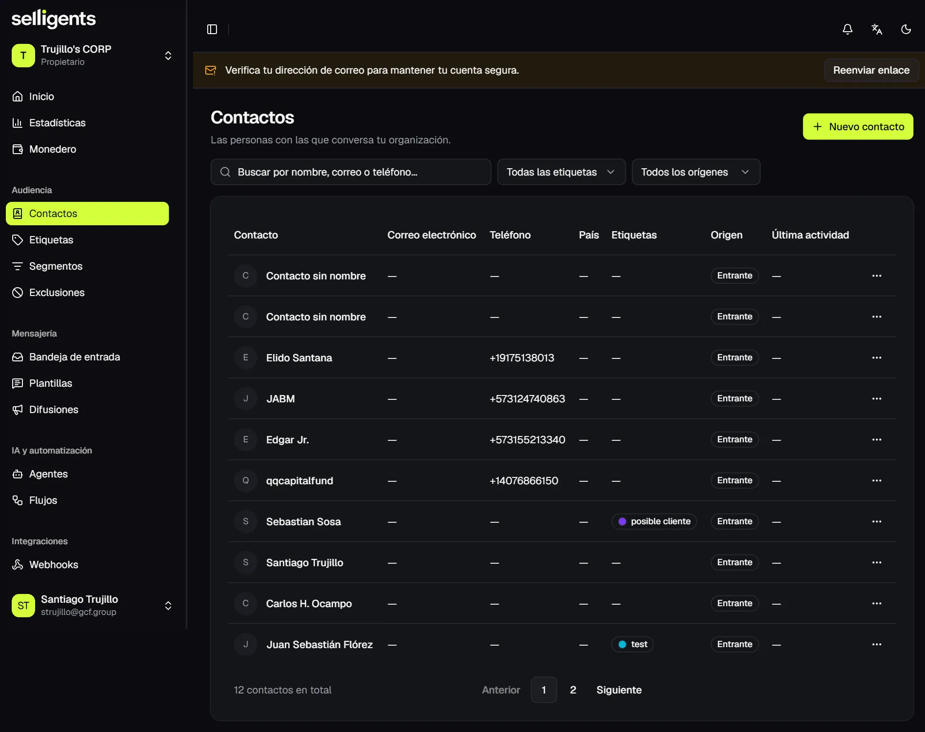 Contacts list with search, tag and source filters, and a table showing the name, email, phone, country, tags, source and last activity of each contact.